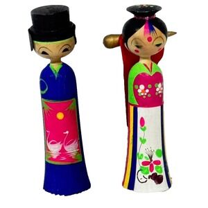 Handmade wooden Kokeshi dolls with colorful designs